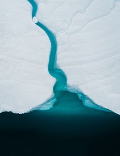 an iceberg with water flowing out of it