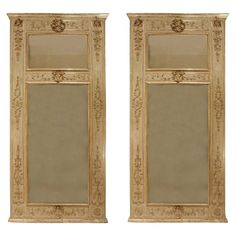 pair of carved wooden doors with mirrors on the front and side panels in gold color