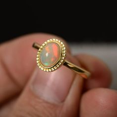 Natural Opal Ring Sterling Silver Yellow Gold Plated Minimalist Oval Cabochon Opal Ring For Anniversary, Oval Cabochon Opal Ring With Polished Finish, Minimalist Oval Opal Ring For Gift, Minimalist Oval Opal Ring Gift, Elegant Ethiopian Opal Ring With Oval Cabochon, Oval Cabochon Opal Ring Fine Jewelry, Elegant Opal Oval Cabochon Ring Gift, Oval Cabochon Opal Ring In Fine Jewelry, Elegant Oval Cabochon Opal Ring Gift