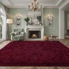 a living room filled with furniture and a red rug on top of a hard wood floor