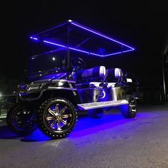 a golf cart is lit up with blue lights