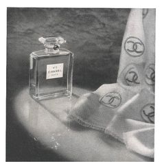 an advertisement for chanel perfumes with the bottle in front