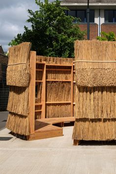 two bookshelves made out of straw and wood