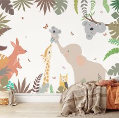 an animal themed wallpaper in a child's room with a bed and blanket