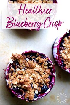 two blueberry crispes are sitting on top of a table with the words healthier blueberry crisp above them