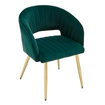 a green velvet chair with gold legs