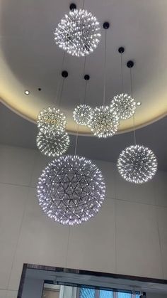 some lights hanging from the ceiling in a room