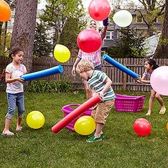 children playing with balloons in the yard