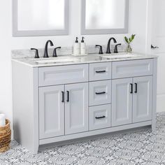 a white bathroom with two sinks and mirrors