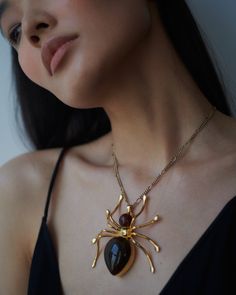 The Neith pillbox necklace is a striking creation from Careste’s AW24 Collection. The finely worked gold-finish metal chain showcases an oversized spider pillbox inspired by the Egyptian Goddess Neith. Gold-Finish Metal Spider Ornamental Pillbox 47 inch chain Amber resin Goddess Neith, Metal Spider, Amber Resin, Egyptian Goddess, Necklace Box, Pill Boxes, Metal Chain, Gold Finish, Amber