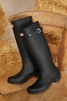 Gloomy days call for a splash-worthy look like the Hunter Original Tall Black Rain Boots! These matte rubber rain boots feature a rounded upper that rises to a 14.75"" knee-high shaft with a 15.5"" circumference. The easy slip-on design features a decorative silver buckle detail at the outstep, while a sturdy low-block heel completes the look. Logo tag at the front and sole. Available in whole sizes only. 0. 75" rubber heel. Lightly cushioned insole. Rubber sole has nonskid markings. Man Made Materials. Imported. Lulus | Original Tall Black Rain High Heel Boots | Size 7. Black Rain Boots, Black Rain, Gloomy Day, Low Block Heels, Rubber Boots, The Hunter, Logo Tag, Rainy Day Outfit, Rubber Heels