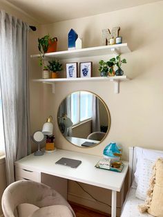 a white desk with a mirror on top of it and a chair in front of it