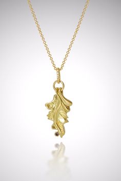 Gold & Stone Necklace - This oak leaf necklace was first carved in wax and cast in 18k gold; it boasts a 2mm round cognac diamond, bezel-set on the side of the piece. Can be artistically layered with multiple necklaces to create a fun and modern look, or worn alone as a statement unto itself! Lobster clasp closure. Gold Stone Necklace, Multiple Necklaces, Oak Leaf Necklace, Cognac Diamonds, Artful Home, Oak Leaf, Gold Stone, Pearl Diamond, Leaf Necklace