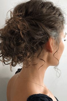 This stylish updo showcases natural curls gathered into a full bun at the nape of the neck, radiating an effortless vibe. Soft tendrils frame the face, lending a romantic and relaxed feel to the style. Ideal for formal events or a night out, this hairstyle beautifully blends structure with the free-spirited essence of - Click to see more of Enchanting Curly Updo Inspirations: 24 Elegant Styles to Elevate Your Look and follow us for more hairstyle ideas. // Photo Credit: Instagram @vb_beauty Bridal Updos For Naturally Curly Hair, Natural Curly Hair Bun Styles, Natural Curls Hairstyles Updo, Curly Low Updo, Natural Curls Hairstyles Wedding, Quick Curly Updo, Curly Bun Wedding Hairstyles, Curly Wedding Hair Updo, Bridal Hair Curly Natural