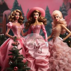 three barbie dolls standing next to each other near a christmas tree