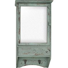 an old blue cabinet with a mirror on top and shelf below it that is painted green