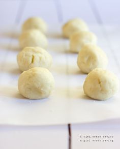 several balls of dough sitting on top of a white counter