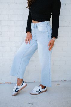 Ice denim pants Adjustable high waistline Button fly closure Cropped bottom Relaxed fit 92% Cotton, 8% Polyester Model is 5'4" with a 25" waist and 38" hips wearing a size small. Size recs: S 2-4 M 6 L 8-10 25" inseam Dark Wash Cropped Jeans For Spring, Dark Wash Cropped Jeans With Button Closure For Spring, High Waist Denim Jeans With Frayed Hem, Trendy High Rise Cropped Jeans, Trendy Medium Wash Cropped Leg Jeans, High Rise Denim Blue Bottoms With Frayed Hem, Light Wash Cropped Jeans For Spring, Light Wash Straight Leg Bottoms With Belt Loops, Light Wash Cropped Jeans With Button Closure For Spring