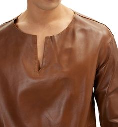 Looking for a way to upgrade your style with a touch of luxury? Look no further than our Brown Leather T Shirt! This luxurious tee is made from premium sheepskin leather and features a soft, supple texture that feels amazing against the skin. The polyester lining ensures ultimate comfort, so you can wear it all day long. Our Brown Leather T Shirt is versatile enough to be dressed up or down. Pair it with jeans and sneakers for a casual look, or dress it up with a pair of slacks and dress shoes f Brown Leather Casual Tops, Casual Brown Leather Top, Casual Brown Leather Tops, Classic Long Sleeve Leather Tops, Classic Leather Tops For Fall, Elegant Leather Tops For Fall, Brown Leather Top For Fall, Elegant Long Sleeve Leather Top, Brown Leather Long Sleeve Top