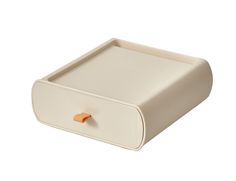 a white drawer with an orange knob on the top and bottom section, sitting in front of a white background