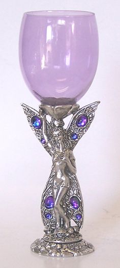 a purple glass with an angel on it