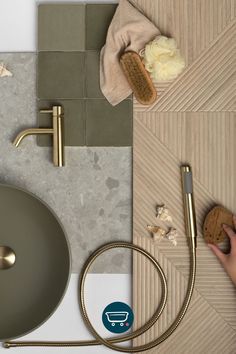 a bathroom sink with gold faucet and soap on the counter top next to it