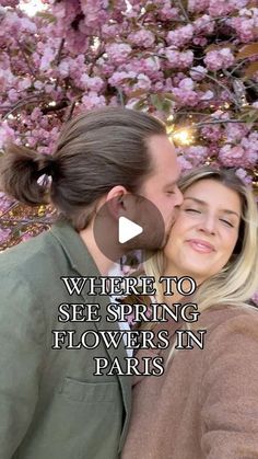 a man and woman kissing in front of pink flowers with the words where to see spring flowers in paris