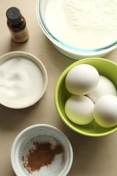 eggs and flour in bowls on a table