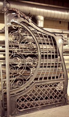 an ornate iron gate in the middle of a building