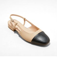 Elevate your everyday looks with these Maxine Cap-Toe Slingback Flats from A New Day™. These solid-color flats feature a faux-leather upper with a round closed-toe vamp accented with a toe cap. Set on a 0.75-inch block heel, they have a cushioned insole and soft fabric lining for comfortable wear. The buckled slingback strap that wraps around your open heel completes the design, offering an airy, adjustable fit. A New Day™: Style that goes wherever you do.