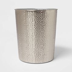 a silver metal cup on a white background