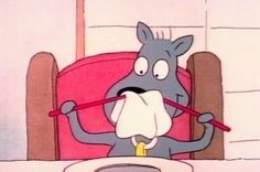 a cartoon character sitting at a table with a knife and fork in his mouth as if he is eating