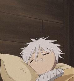 an anime character laying in bed with his eyes closed and head resting on the pillow