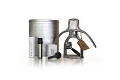 a metal canister and other items are shown in front of a white background,