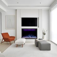 a modern living room with an electric fireplace