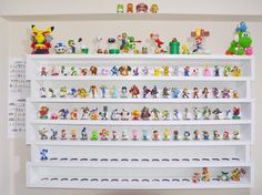 the shelves are filled with various toy figurines