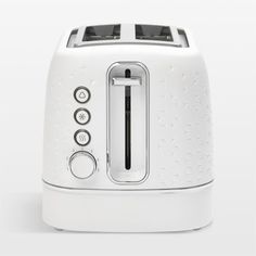 a white toaster sitting on top of a table