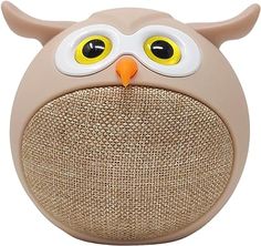 an owl shaped speaker with yellow eyes