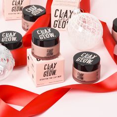 several different types of clay glow products with red ribbon