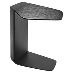 a black table with a curved shelf on it