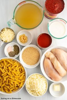 the ingredients to make pasta are laid out in bowls