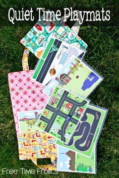 several pieces of paper laid out on the grass with text that reads quiet time playmats