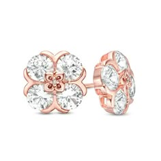 With a touch of floral charm, these lovely stud earrings are sure to become an instant favorite. Crafted in precious 10K rose gold, each pretty earring showcases a quartet of 5.0mm lab-created shimmering white sapphires. The sculpted flower-shaped center design sparkles with a diamond accent. Buffed to a brilliant luster, these post earrings secure comfortably with friction backs. Mens Diamond Stud Earrings, Gold Bar Earrings Studs, Ear Tops, Clean Gold Jewelry, Silicone Wedding Rings, Diamond Cluster Earrings, Jewelry Design Drawing, Bar Stud Earrings, Peoples Jewellers