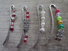 four pairs of bracelets with owl charms on them