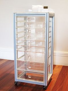 an empty display case sitting on top of a hard wood floor