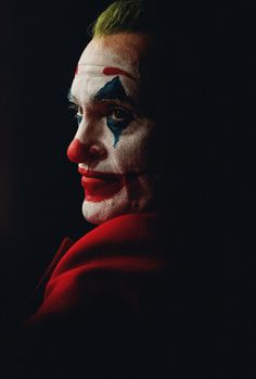 a close up of a person with clown makeup