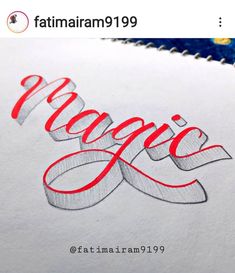 an image of the word magic written in red and silver ink on white paper with a blue background