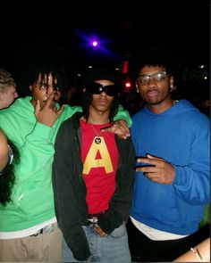 three young men standing next to each other