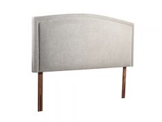 an upholstered headboard with wooden legs and nail polishing on the sides