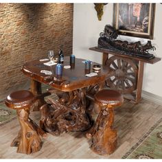 a wooden table with two stools next to it